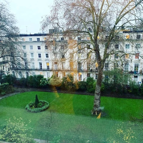 London garden square at dusk